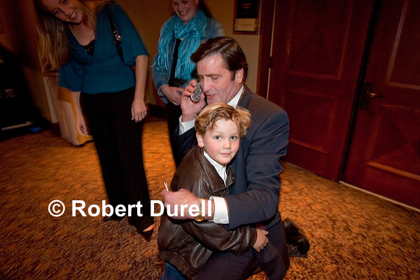 GRANDPA --- John Garamendi decided that the noisy hotel ballroom of the Democratic election night party was not the best place to take a congratulatory cellphone call on his victory as the state's new lieutenant governor. Instead, he took the call out in the hallway, holding his grandson close. This seemed a perfect visual intersection between Garamendis personal and political life.
November 7, 2006. 

