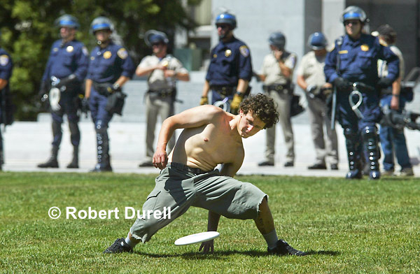 PEOPLE'S PARK --- If the Capitol is referred to sometimes as the People's house, then the grounds around it must be the People's Park. And a man who gave me his name as Hillbilly treated it as such, even though state police in riot gear were there as well. The day before, more than two dozen people had been arrested in the park during a demonstration against the production of genetically modified plants and animals. June 23, 2003.
