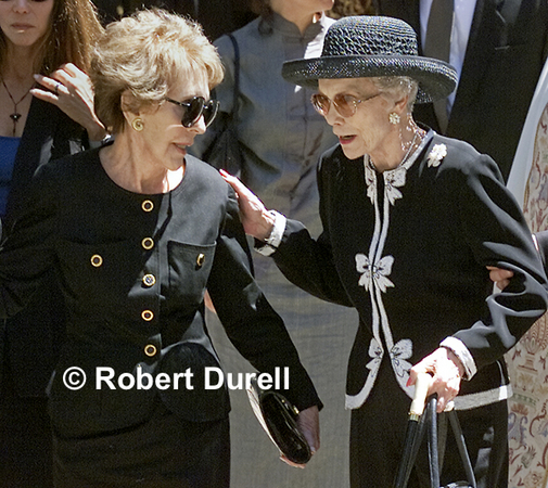 FIRST LADIES --- The funeral mass for Maureen Reagan would have been a subdued event had it not been for the public and press standing for hours outside the Cathedral of the Blessed Sacrament, waiting to see who would emerge. This image is an example of where patience and knowing where to stand paid off. Two of the last to leave the service were two of President Ronald Reagan's former wives, First Lady Nancy Reagan and movie star Jane Wyman, Maureen's mother.
August 17, 2001
