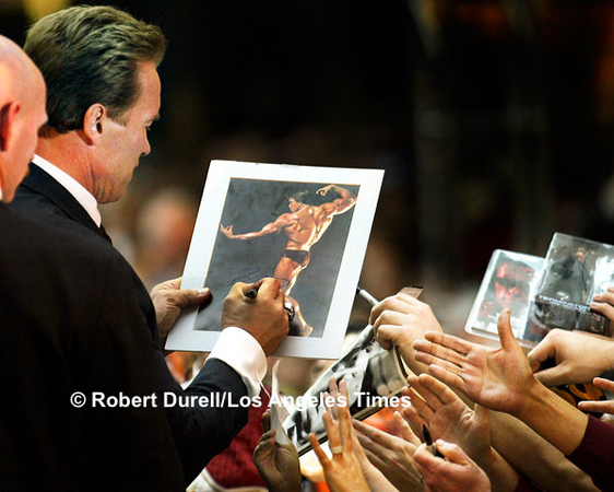 CONSTITUENTS --- Even though his message was serious - push the California Recovery Plan - newly elected Gov. Arnold Schwarzenegger frequently found himself surrounded by people who seemed to be bigger fans of Schwarzenegger the actor than Schwarzenegger the governor. Dozens held up photographs to be signed.
December 6, 2003