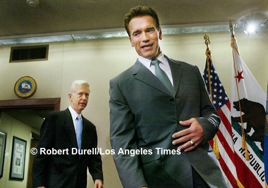 BATON PASS --- Body language was on my mind when I was picked as the lead pool photographer for the first official meeting between Governor-elect Arnold Schwarzenegger and recalled Gov. Gray Davis. Who would enter the inner-sanctum first: its new tenant or its old? Where would they sit? Together? Apart? Would they look at each other? This photo told the story for me and, I hope, for the people who saw it.
October 23, 2003.